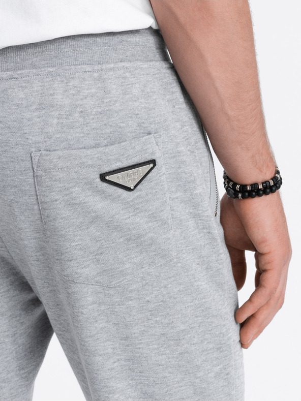 Ombre Clothing Svetlošedé pánske tepláky Ombre Clothing